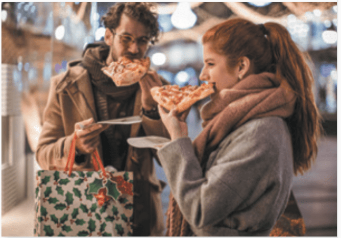 woman eating pizza